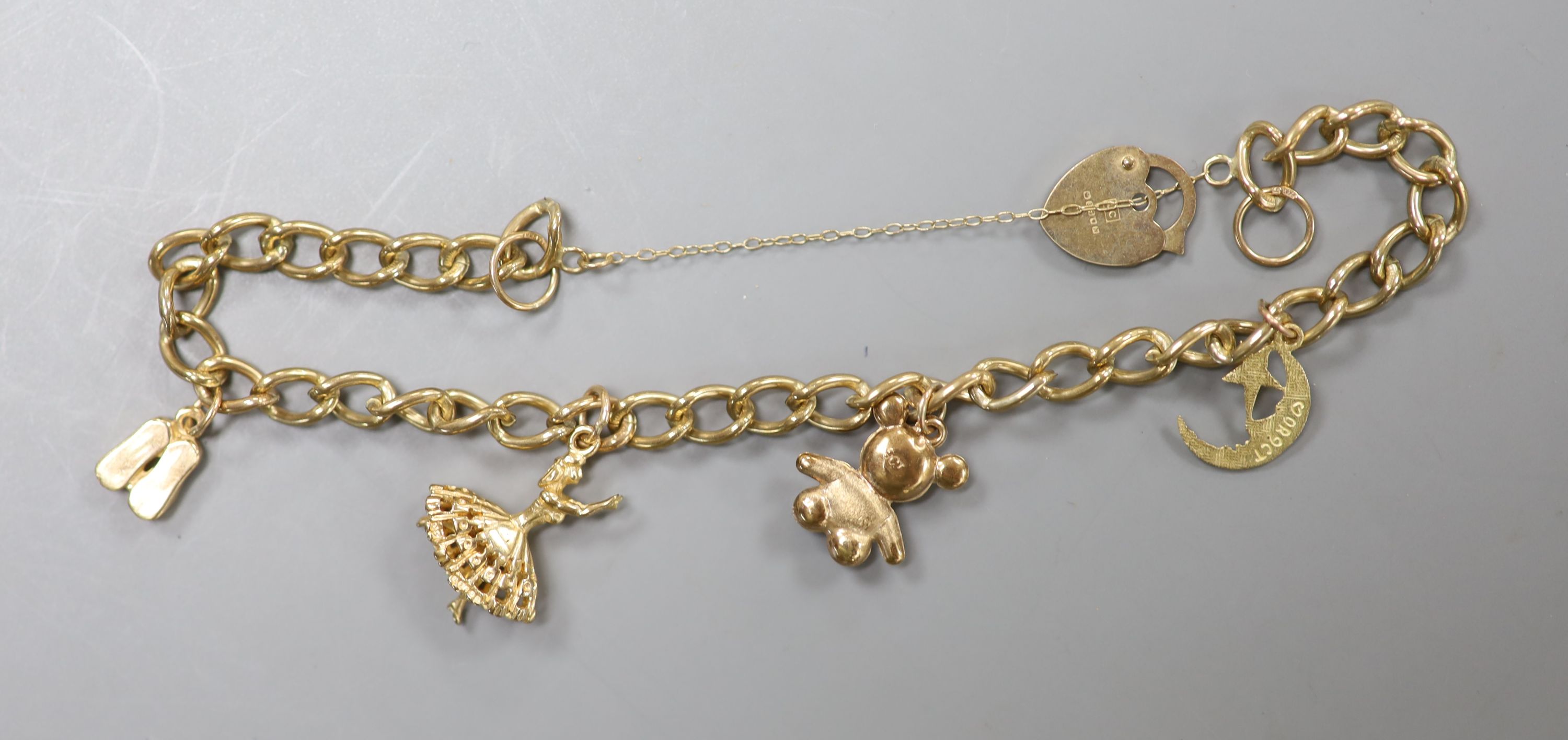 Three assorted modern 9ct gold bracelets, including charm and ropetwist